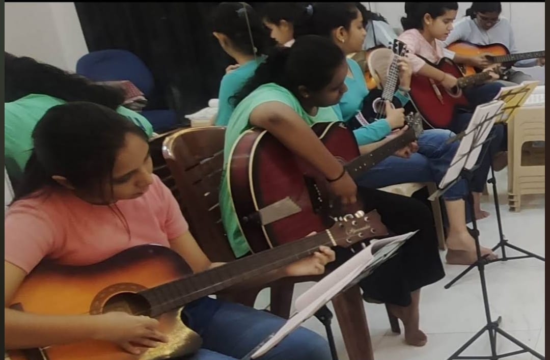 Vocal and harmonium lesson with children